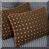 D065. Pair of pillows with square pattern.